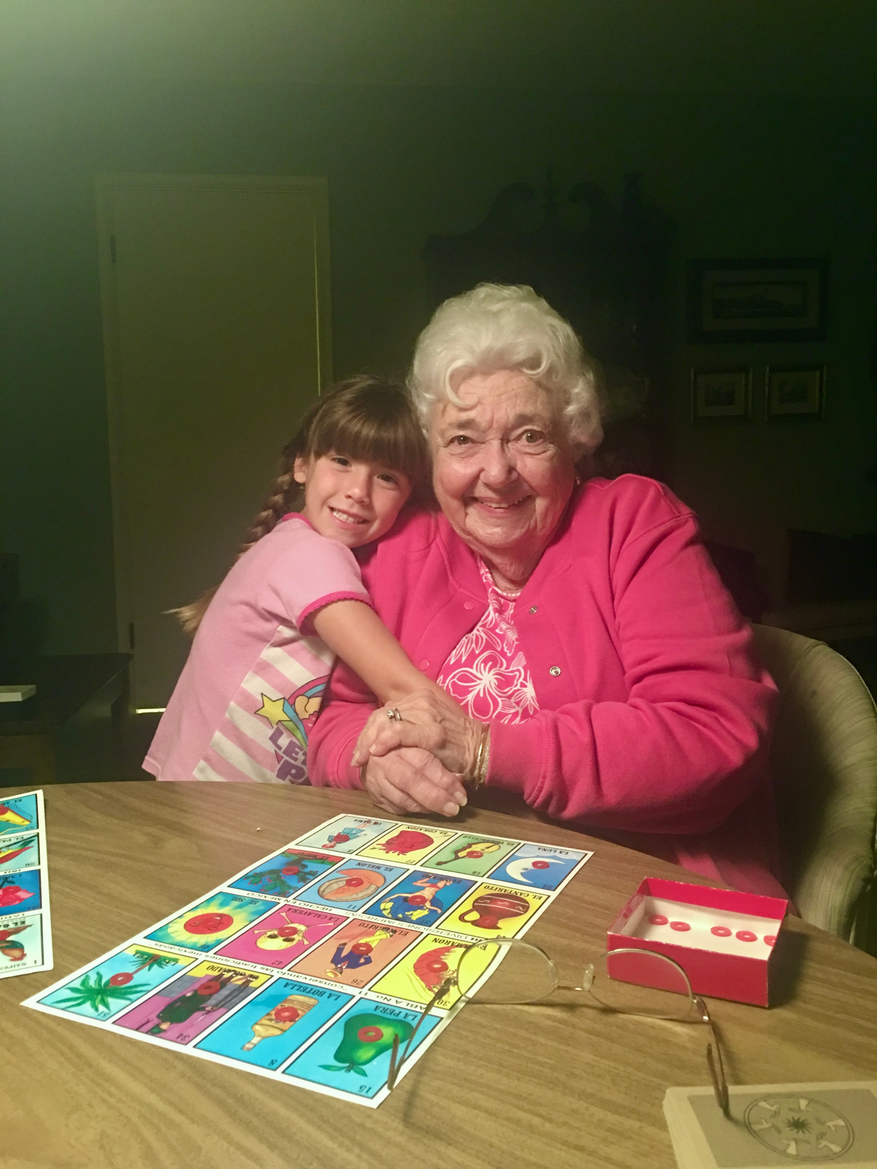 Grandmother and granddaughter playing Lotería