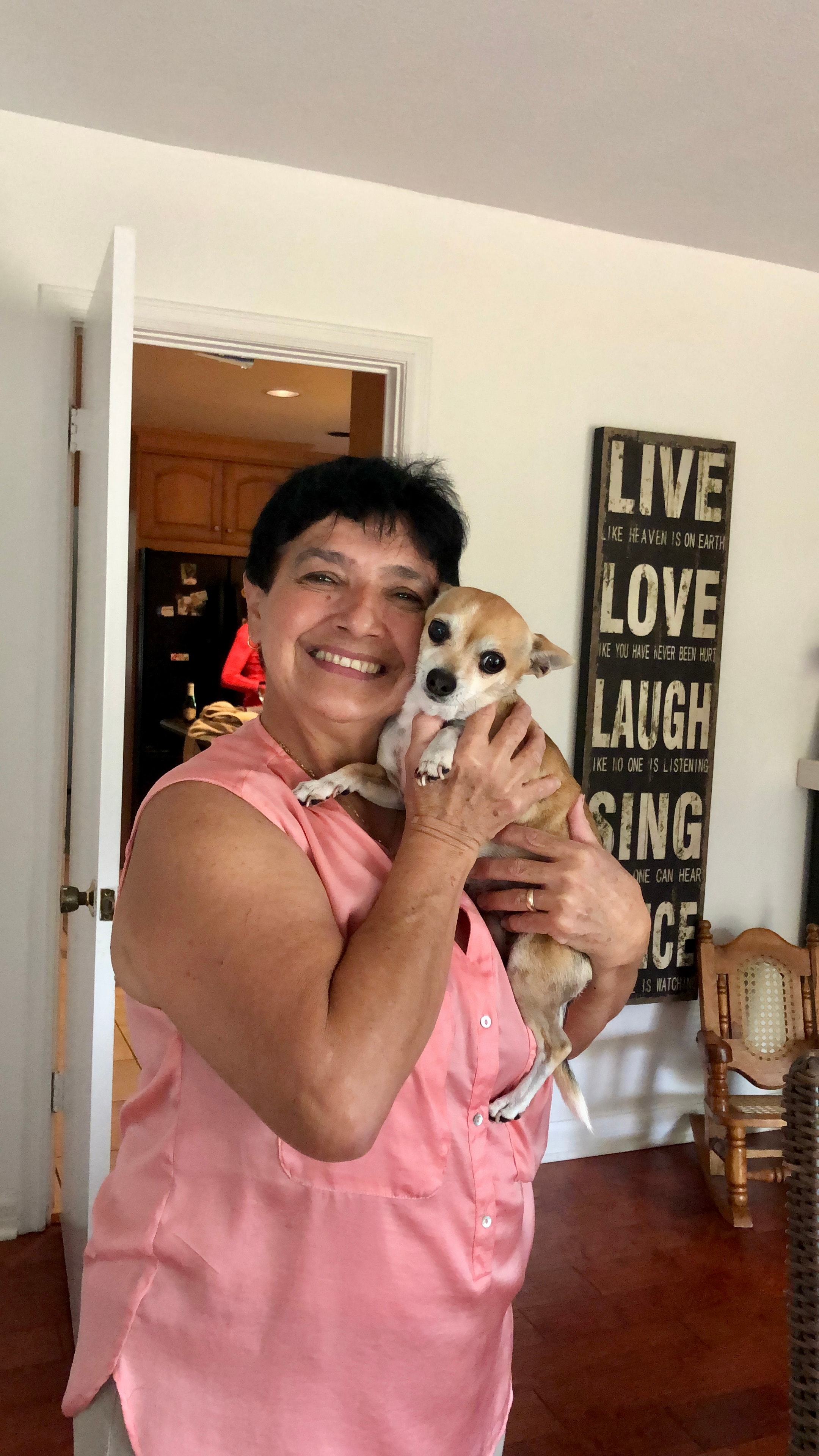 Client smiling with her dog